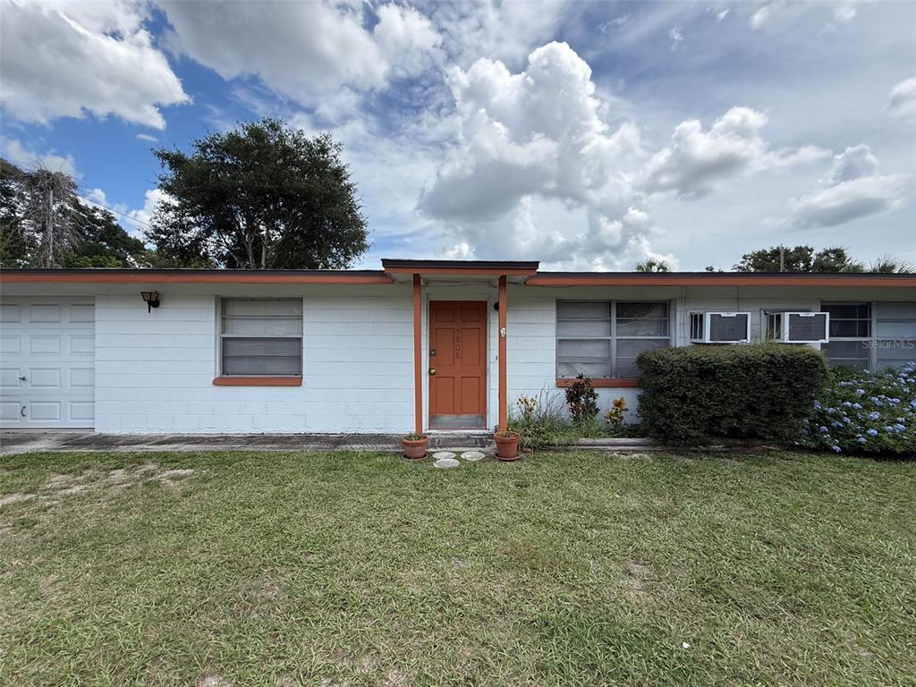 5800 Madison Street New Port Richey, FL 34653 - Photo 9 of 71 a view of a house with a yard and plants