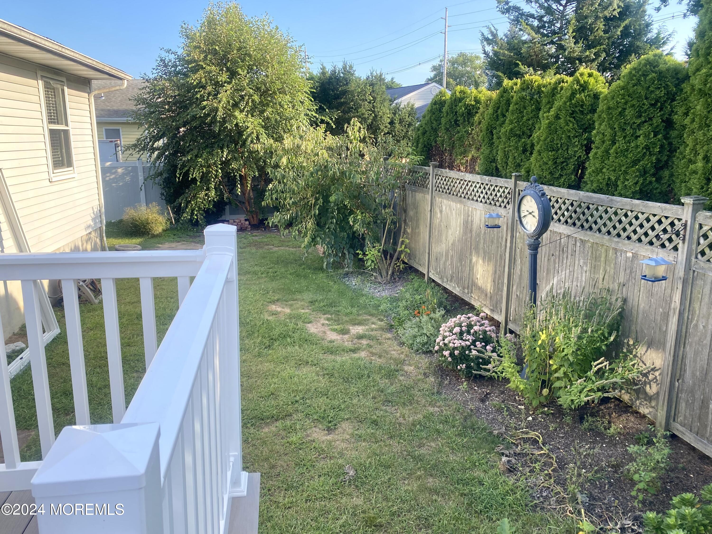 108 Chatham Lane, Unit B Point Pleasant, NJ 08742 - Photo 12 of 14 a view of a garden with wooden fence