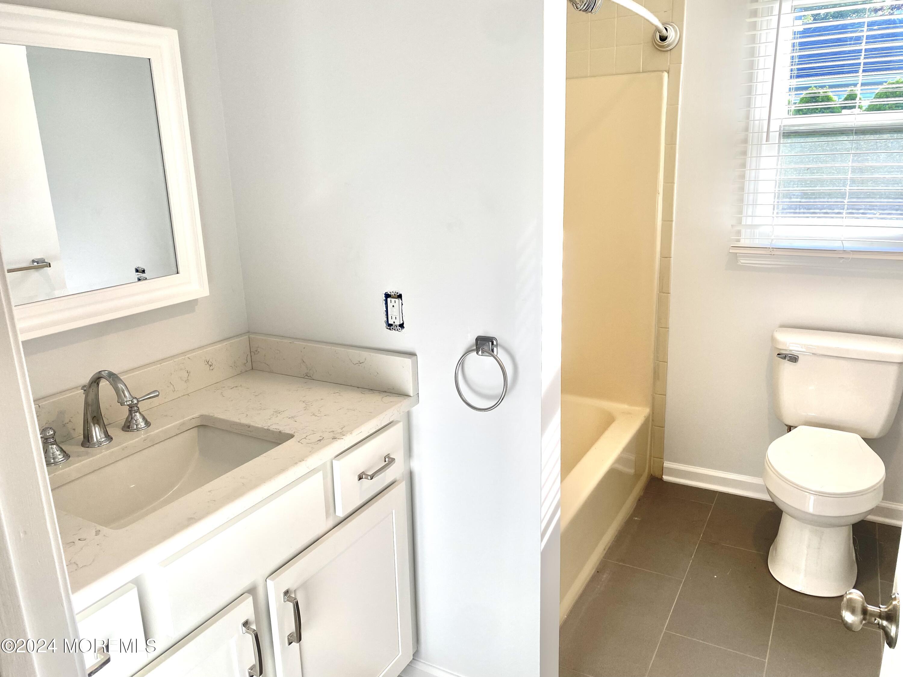 108 Chatham Lane, Unit B Point Pleasant, NJ 08742 - Photo 7 of 14 a bathroom with a sink toilet and mirror