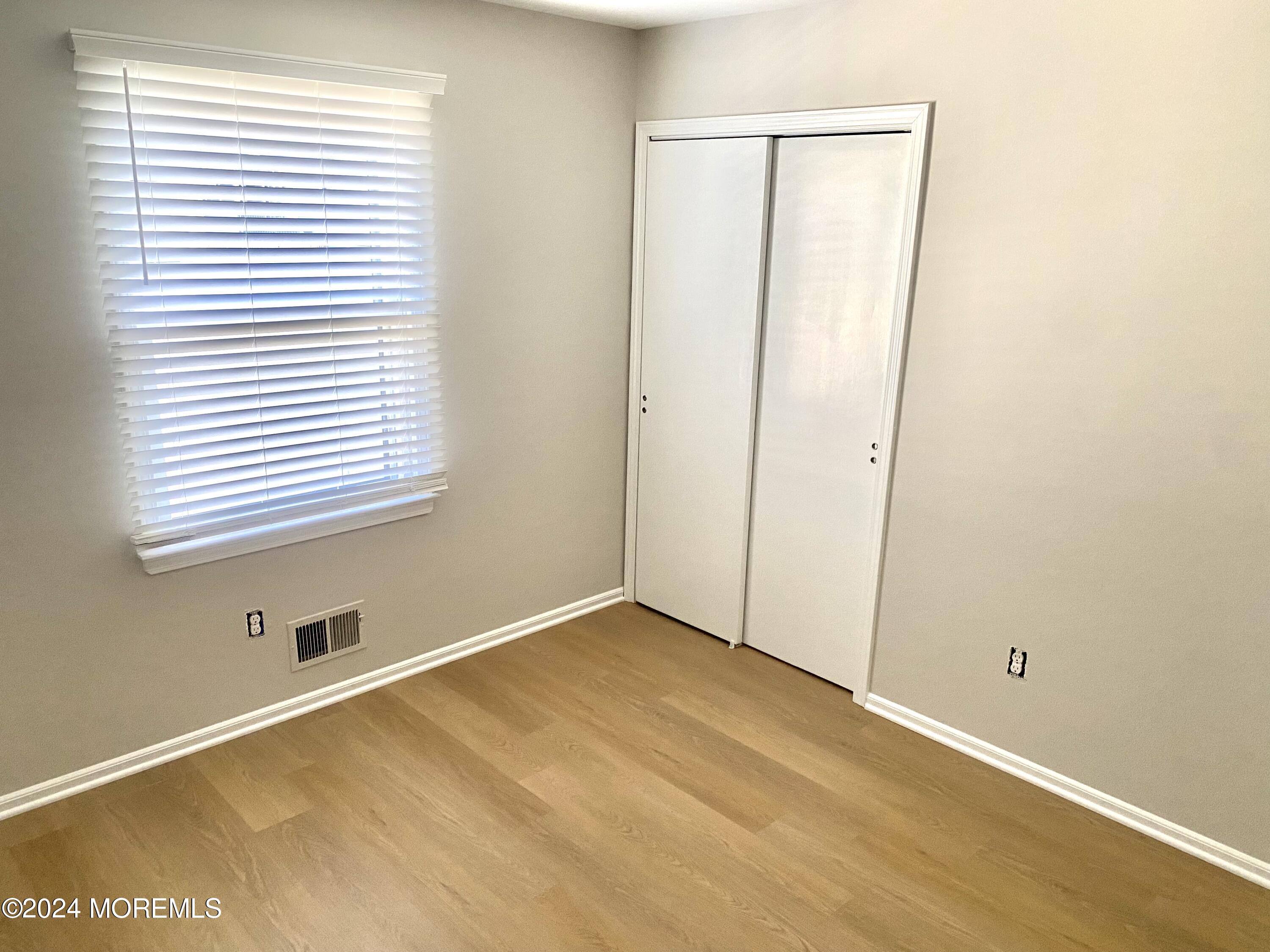 108 Chatham Lane, Unit B Point Pleasant, NJ 08742 - Photo 8 of 14 a view of an empty room with a window