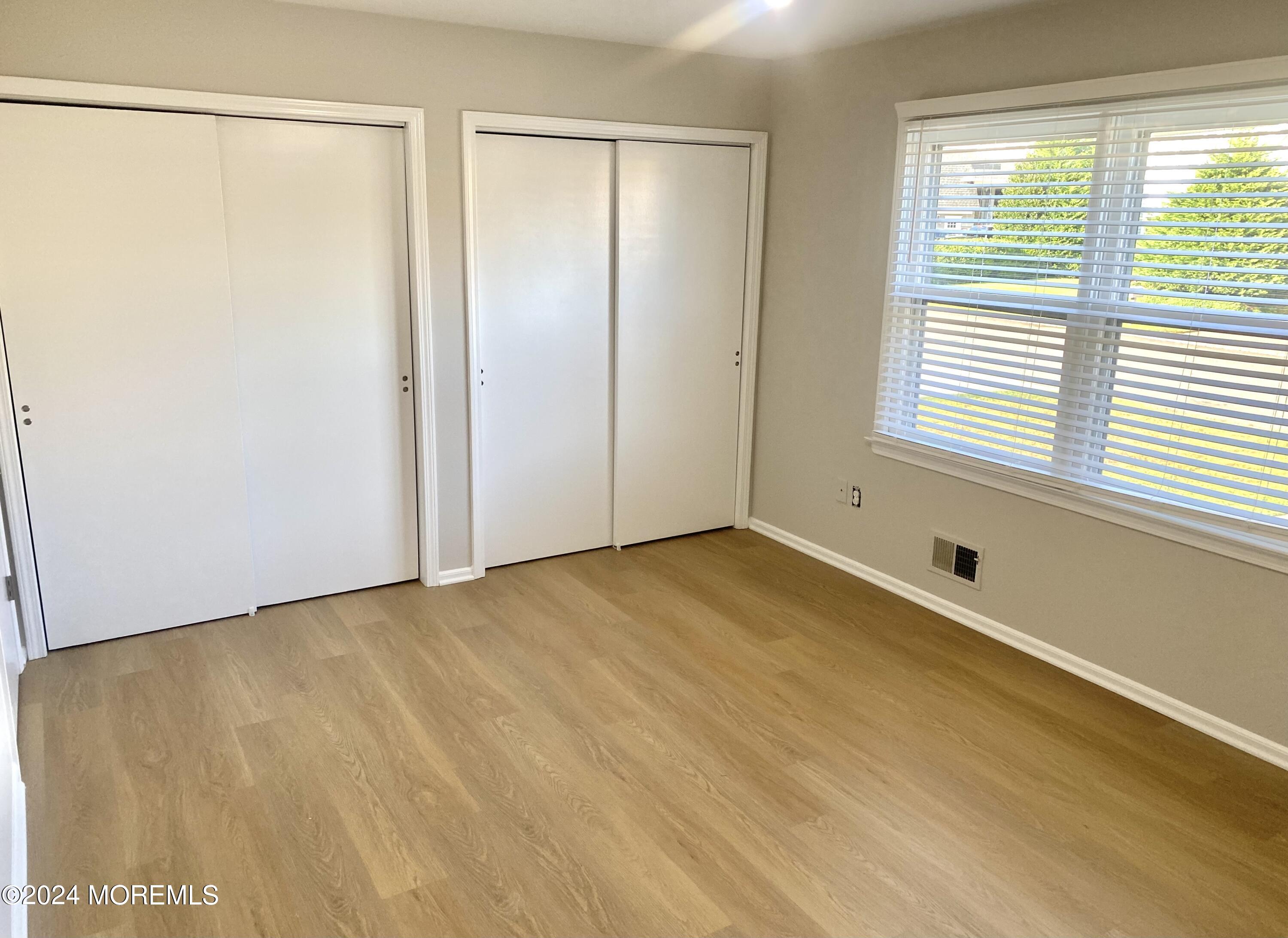 108 Chatham Lane, Unit B Point Pleasant, NJ 08742 - Photo 9 of 14 a view of an empty room with a window