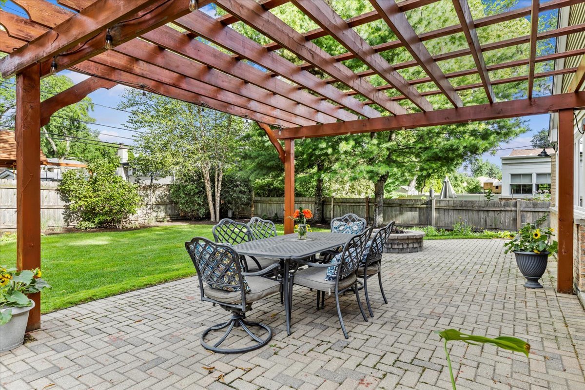 40 Williamsburg Road Evanston, IL 60203 - Photo 6 of 26 a view of a patio with a table chairs and a backyard