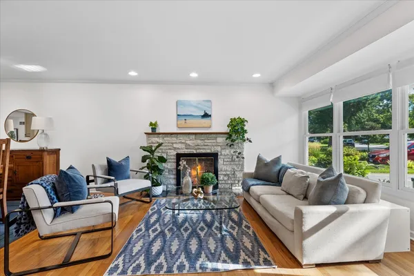 a living room with furniture and a fireplace