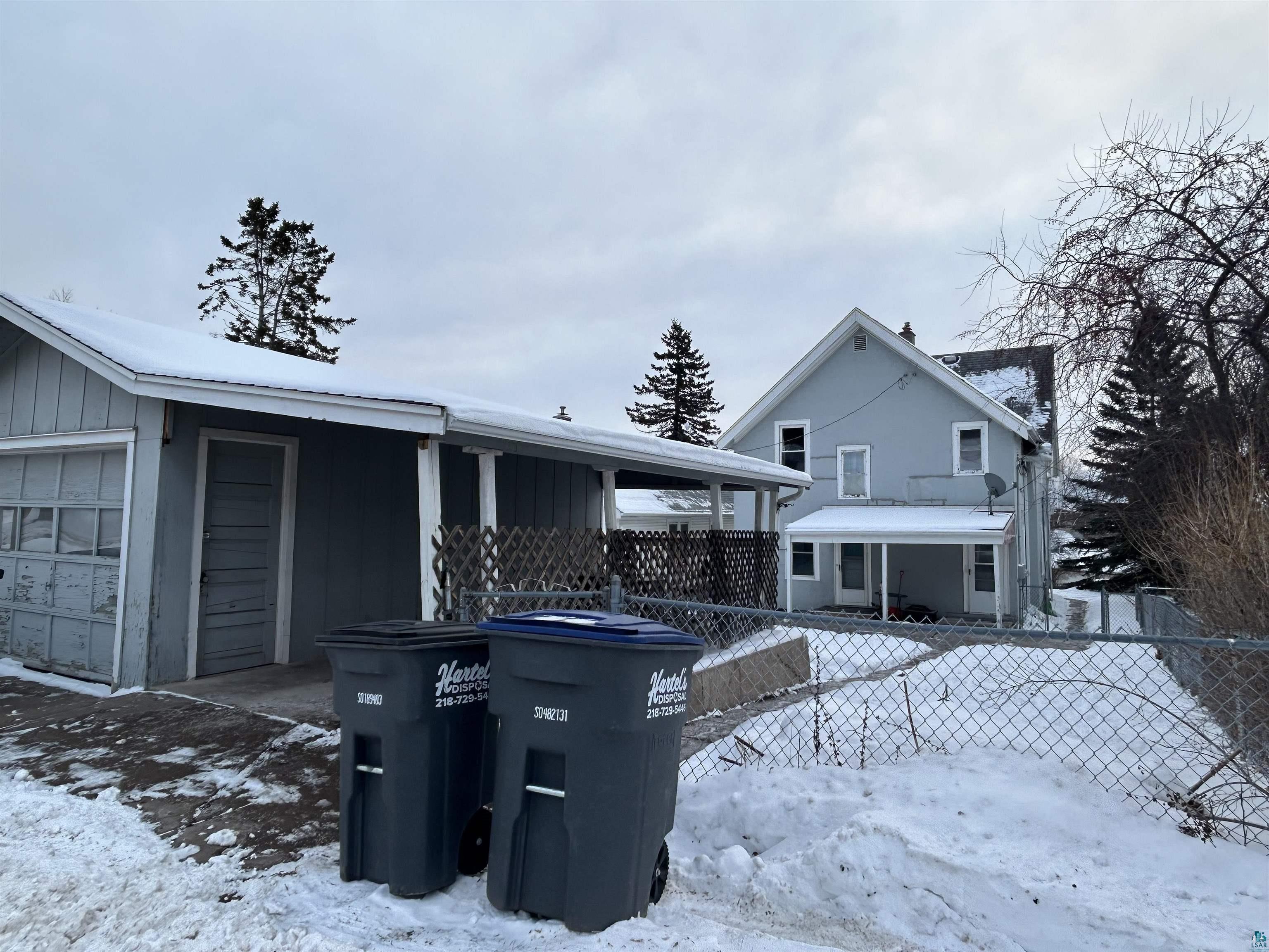 4405 West 7th Street Duluth, MN 55807 - Photo 13 of 18 View of front of house featuring a garage and board and batten siding