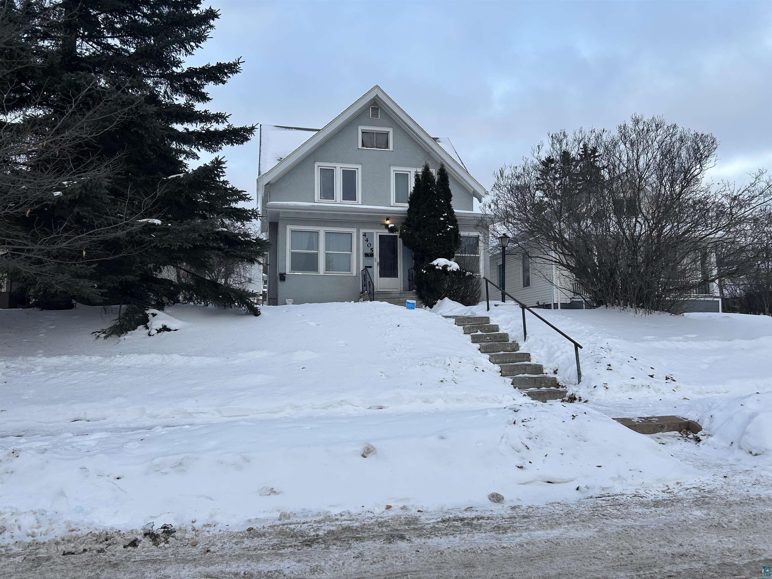 4405 West 7th Street Duluth, MN 55807 - Photo 17 of 18 View of front facade with stairs and stucco siding