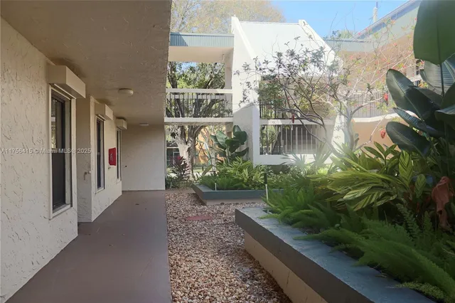 a view of a back yard of the house