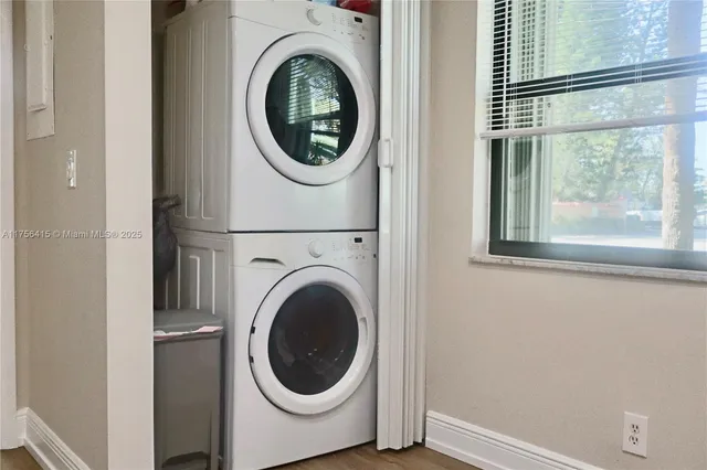 a view of a hallway with washer and dryer
