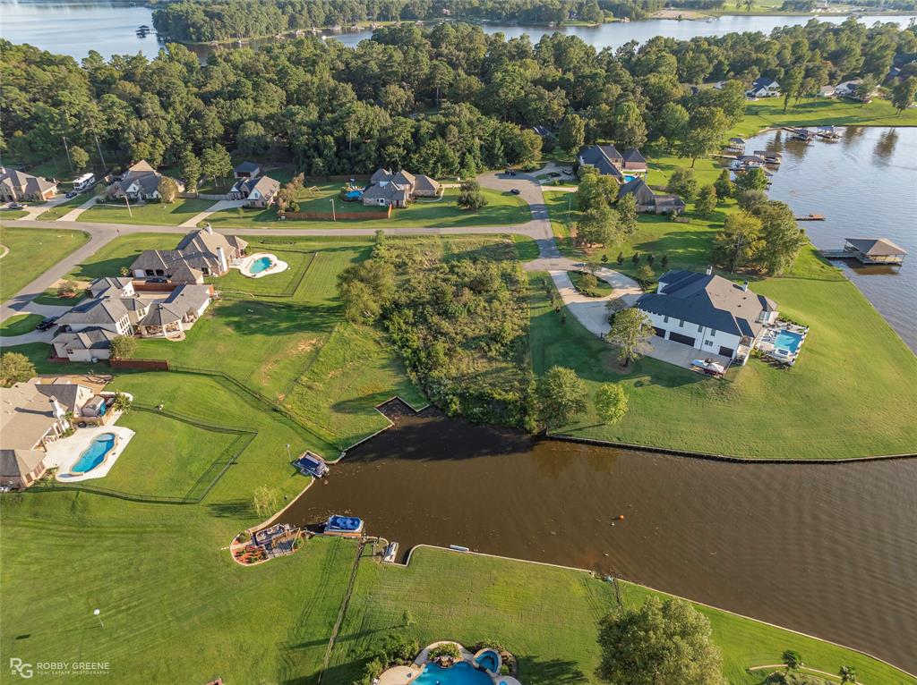 1104 Long Key Circle Benton, LA 71006 - Photo 1 of 11 an aerial view of a golf course with a lake view