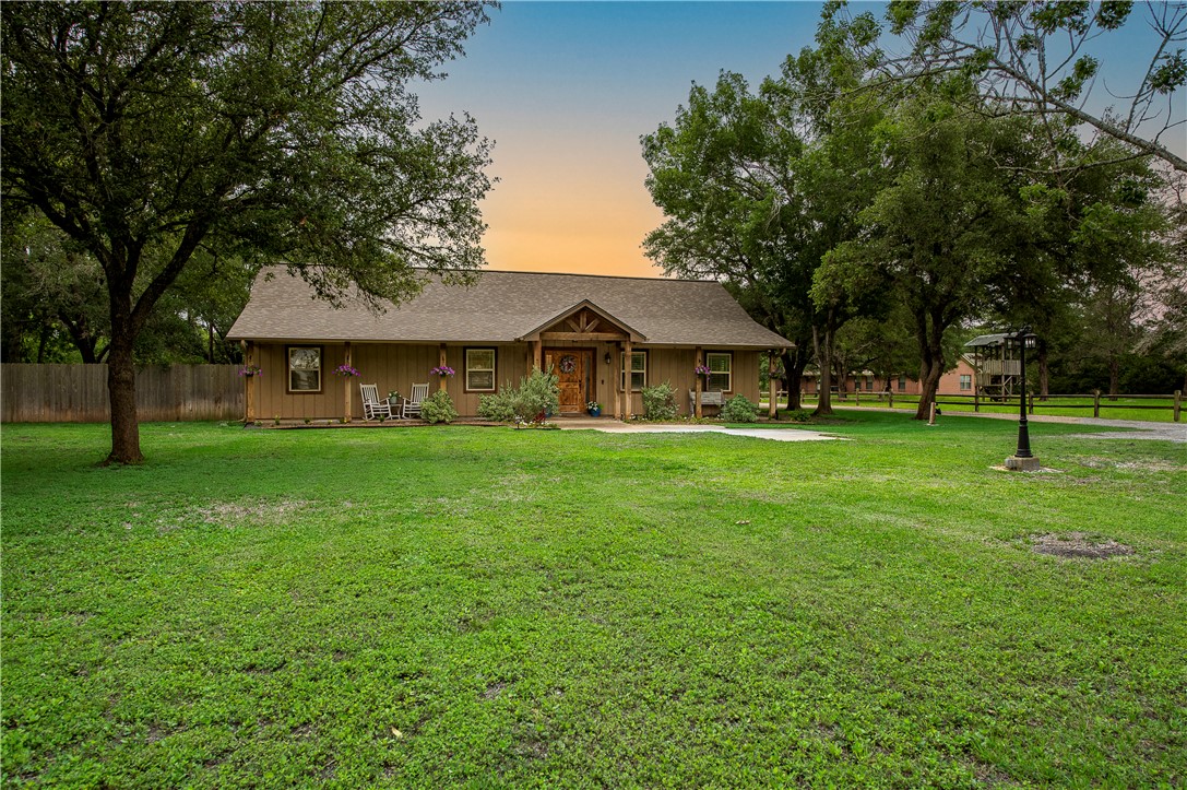 2302 Quail Run College Station, TX 77845 - Photo 3 of 49 a front view of a house with a yard