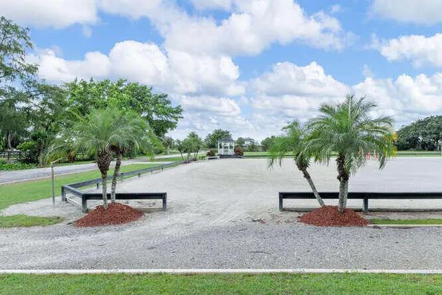 a view of house with backyard and outdoor seating