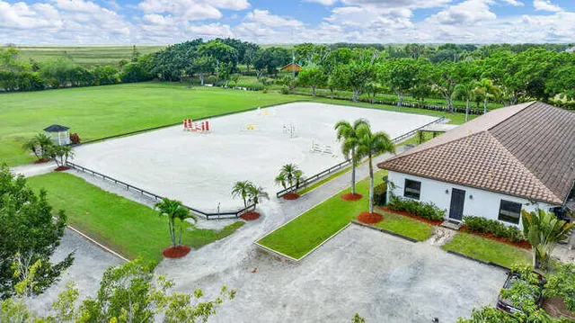 a view of yard with swimming pool and green space