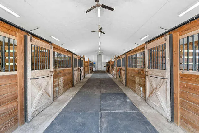 a view of a porch with wooden floor and windows