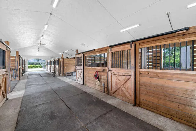 a view of a porch with furniture fire pit and front door