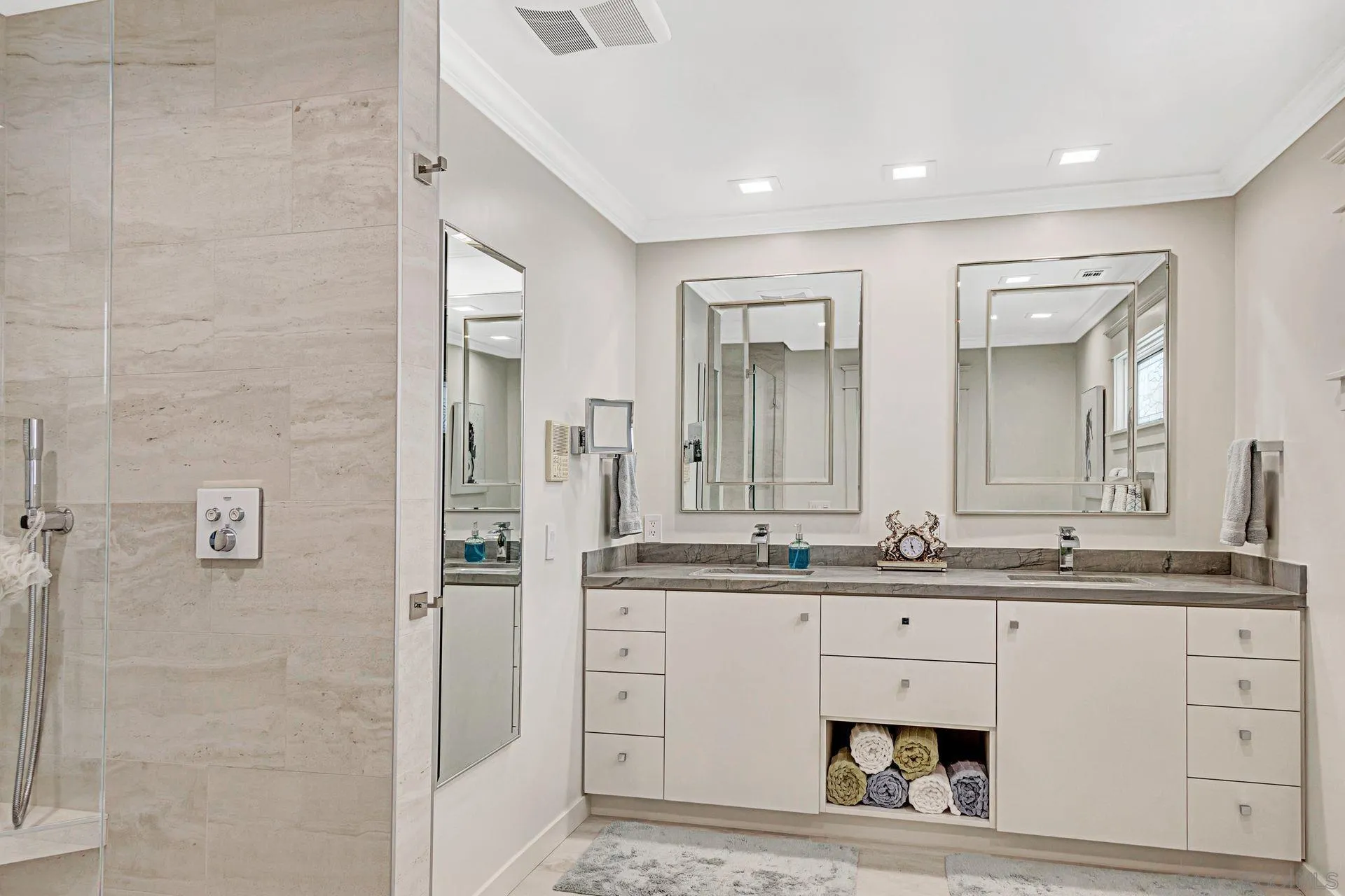 441 A Avenue Coronado, CA 92118 - Photo 14 of 27 a bathroom with a double vanity sink and mirror