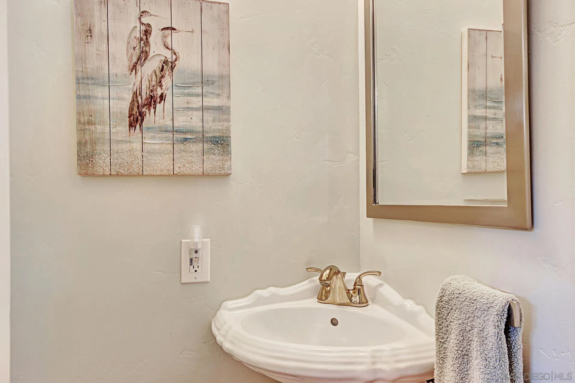 441 A Avenue Coronado, CA 92118 - Photo 23 of 27 a bathroom with a sink and mirror with window