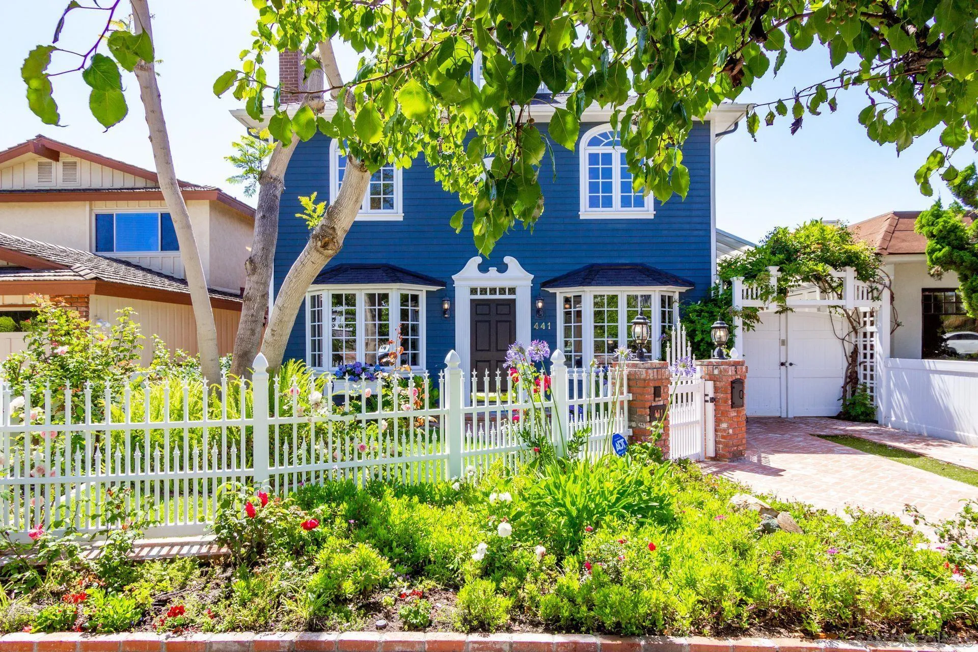 441 A Avenue Coronado, CA 92118 - Photo 3 of 27 a front view of a house with a garden