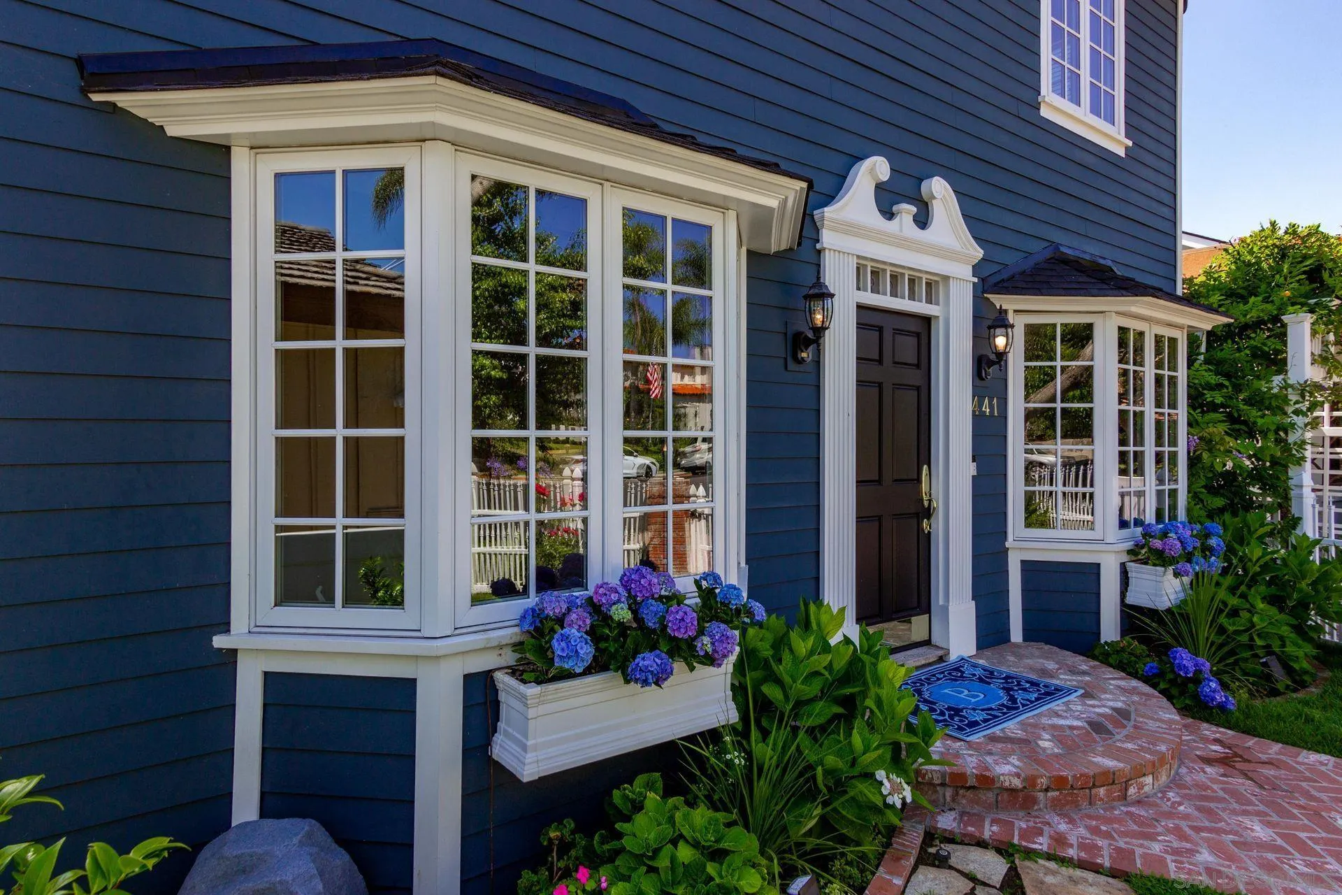 441 A Avenue Coronado, CA 92118 - Photo 6 of 27 a front view of a house with a garden