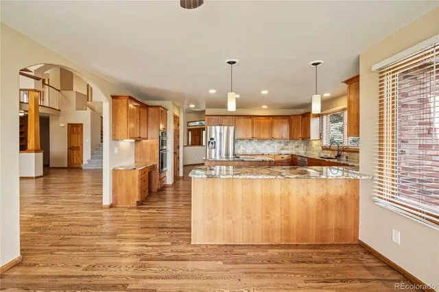 a view of a living room and kitchen