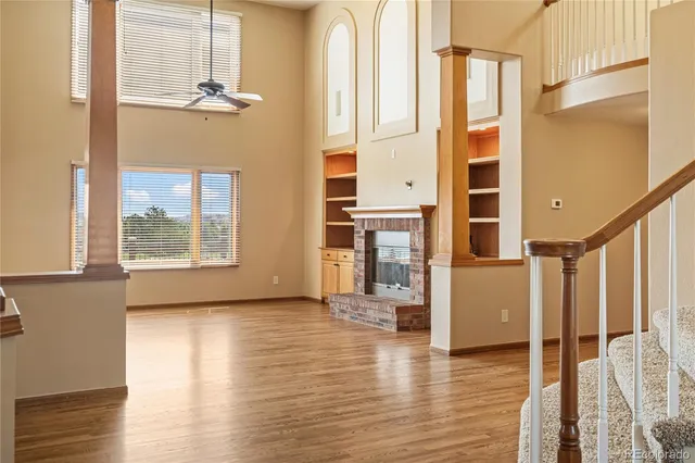 a view of an entryway with wooden floor
