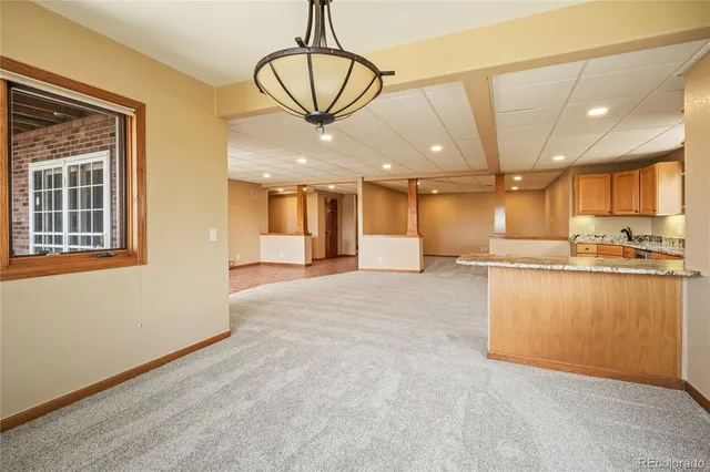 a bathroom with a granite countertop sink toilet mirror and shower