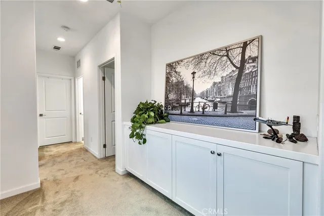 a view of hallway with a potted plant