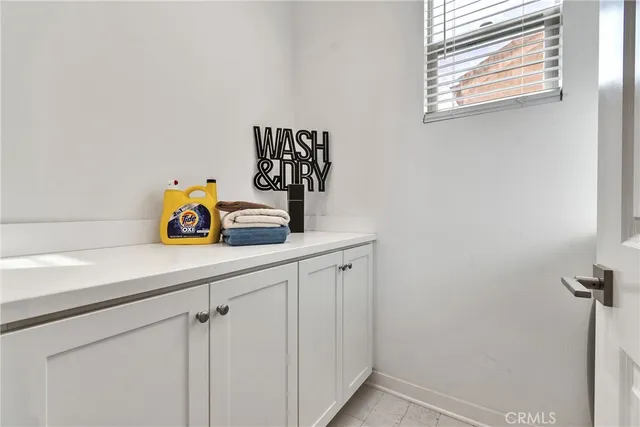 a bathroom with a sink and a window