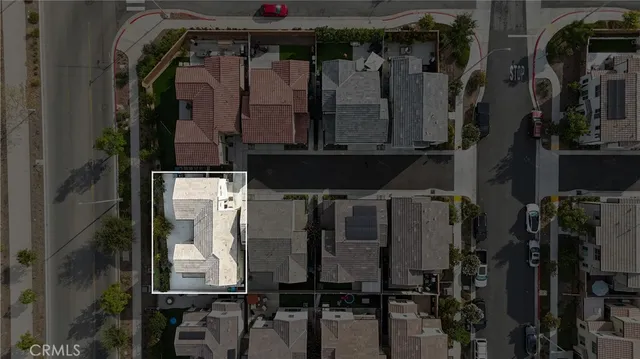 an aerial view of house with yard and mountain view