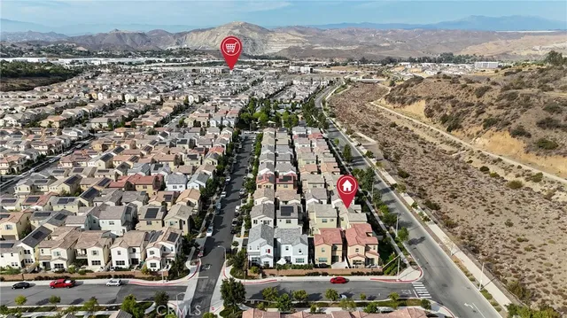 an aerial view of a house with a yard