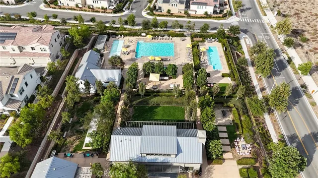 an aerial view of a residential houses with outdoor space