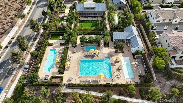 a large building with mountains in the background