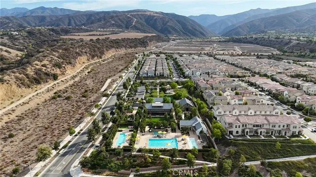 an aerial view of a house with garden space and street view
