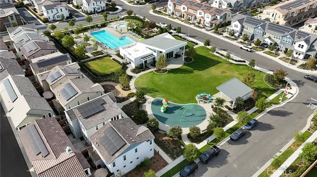 an aerial view of a house with swimming pool outdoor space and mountain view