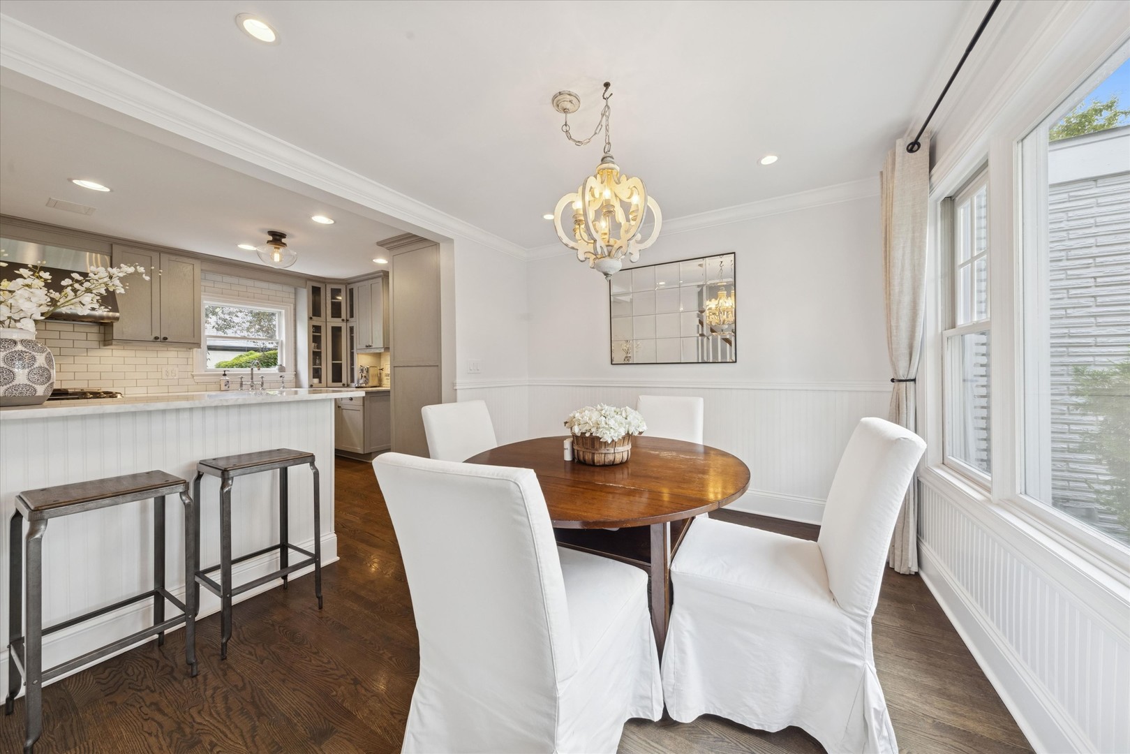 561 North County Line Road Hinsdale, IL 60521 - Photo 5 of 30 a view of a dining room with furniture wooden floor and chandelier