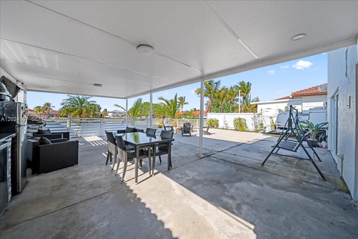 15341 Southwest 36th Street Miami, FL 33185 - Photo 47 of 56 a view of a dining room with furniture window and outside view