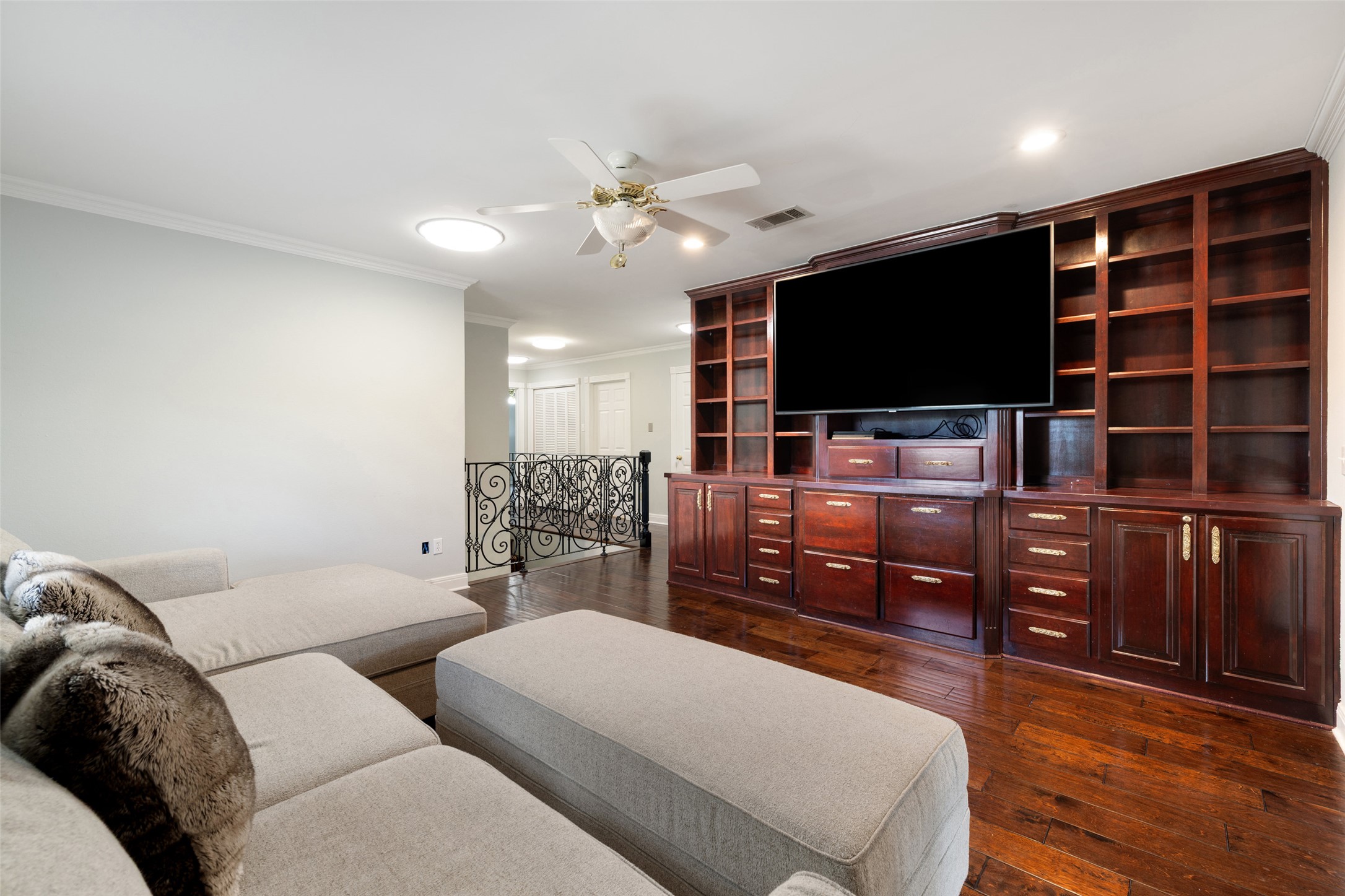 17700 North Rim Drive Leander, TX 78641 - Photo 27 of 38 Living room with ornamental molding, dark wood-style flooring, ceiling fan, recessed lighting