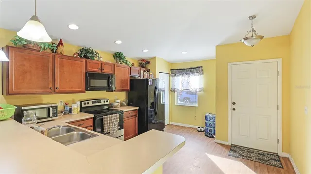 a kitchen that has a lot of cabinets in it