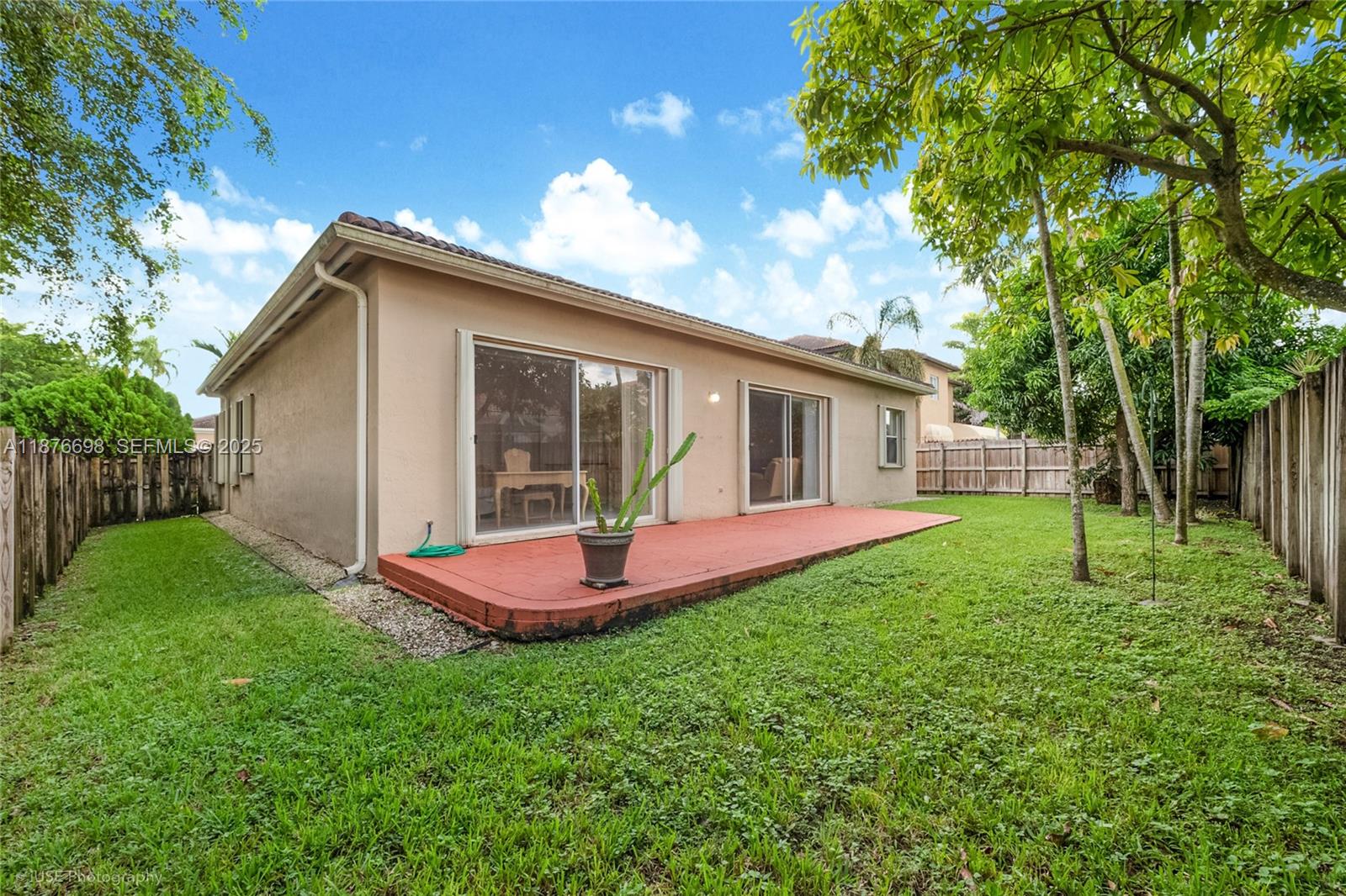 15503 Southwest 151st Street Miami, FL 33196 - Photo 15 of 16 a view of a house with a yard and porch
