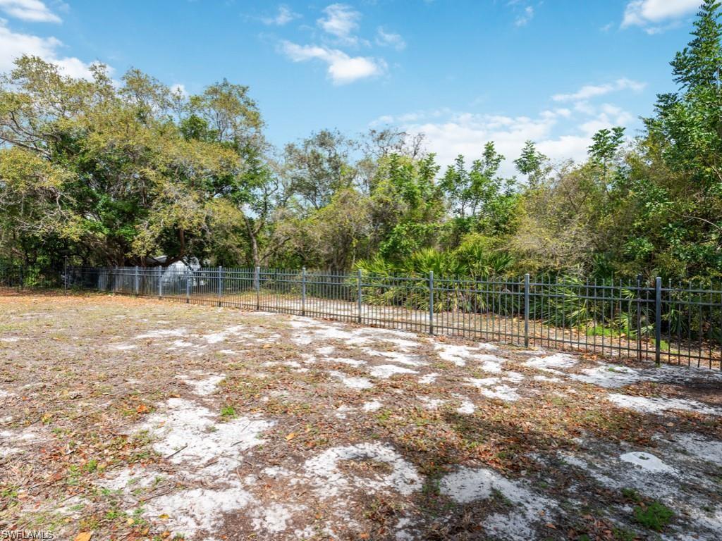 7016 Trail Boulevard Naples, FL 34108 - Photo 25 of 25 a view of a yard with a tree