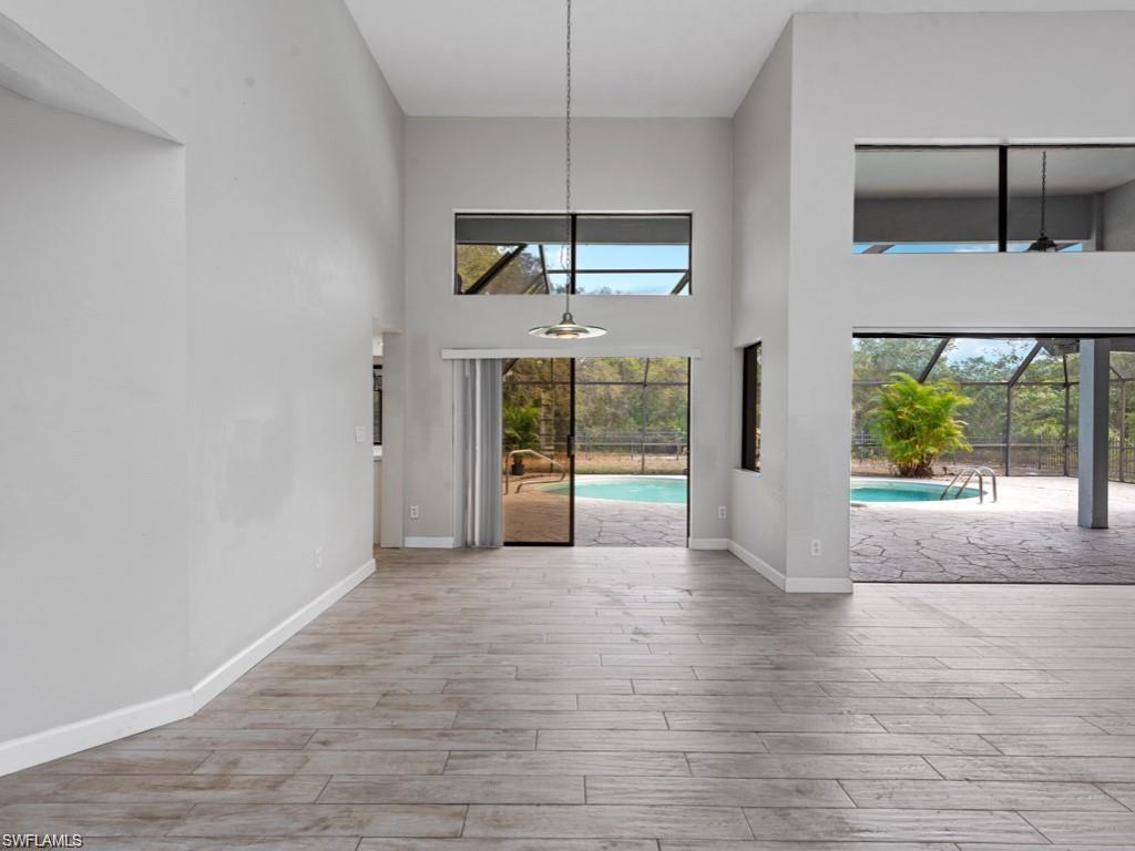 7016 Trail Boulevard Naples, FL 34108 - Photo 5 of 25 a view of an empty room with a window