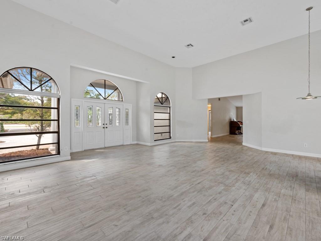 7016 Trail Boulevard Naples, FL 34108 - Photo 6 of 25 a view of a livingroom with furniture and window