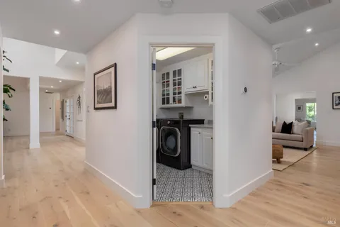 a living room with furniture and a floor to ceiling window