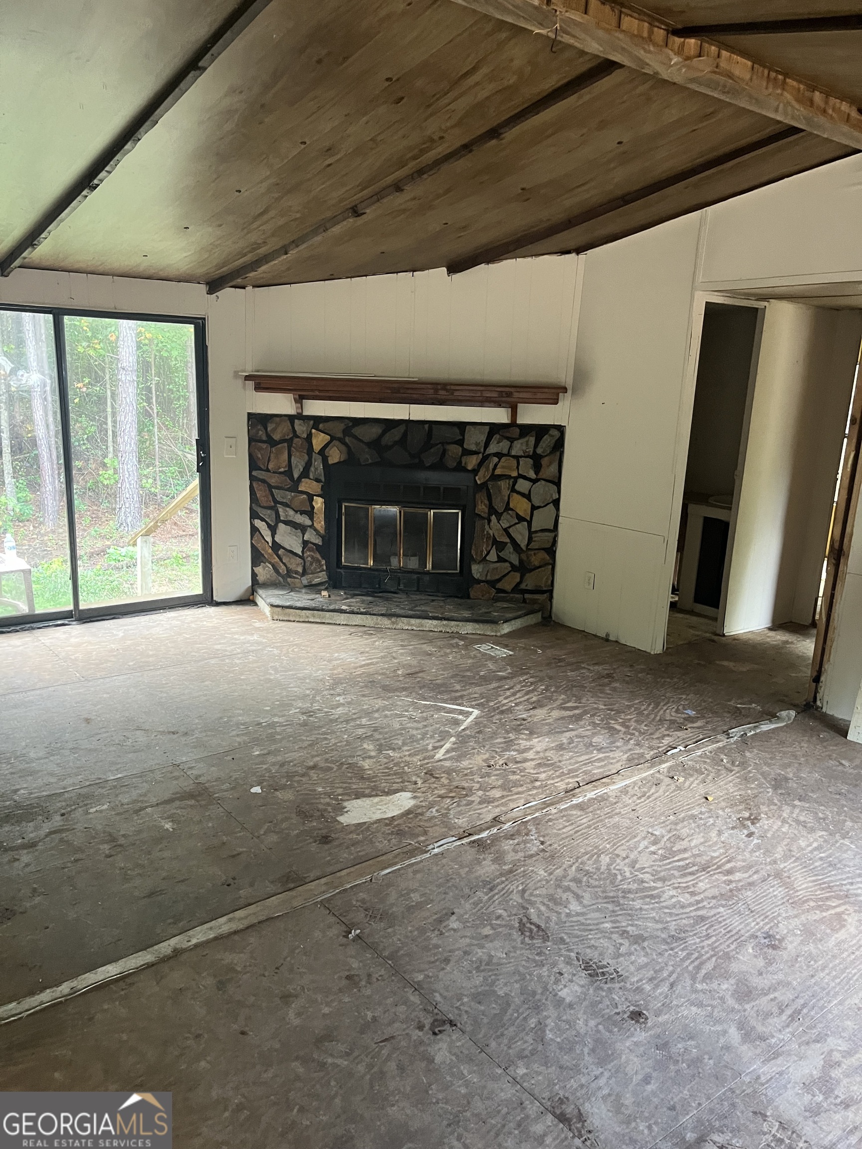 101 Rainey Lake Road Buchanan, GA 30113 - Photo 1 of 1 a view of an empty room with windows