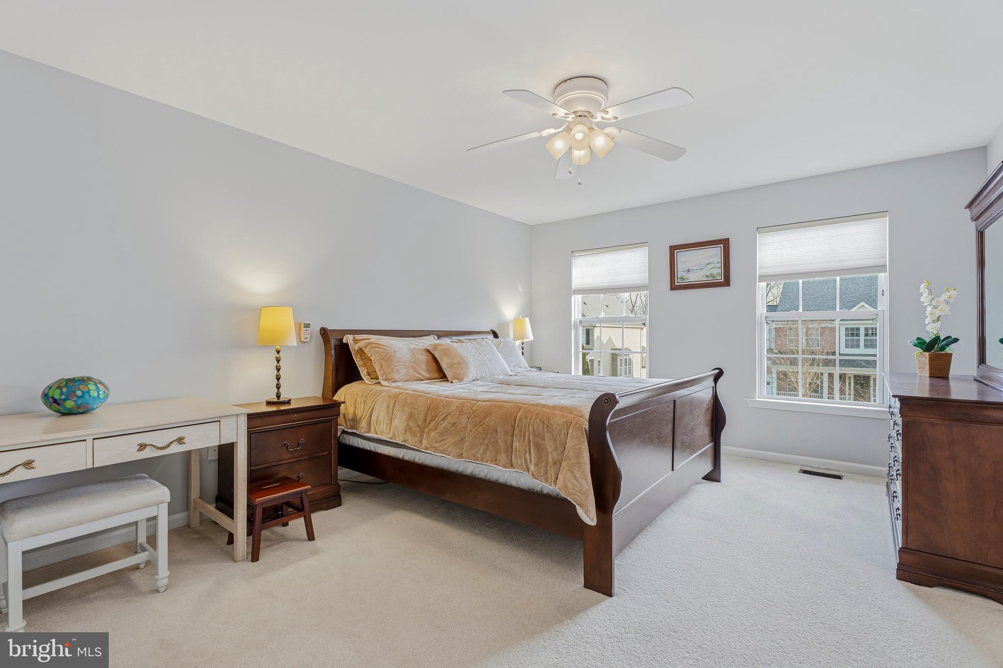 8876 Paddock Lane Baltimore, MD 21234 - Photo 15 of 37 a bedroom with a bed and a chandelier