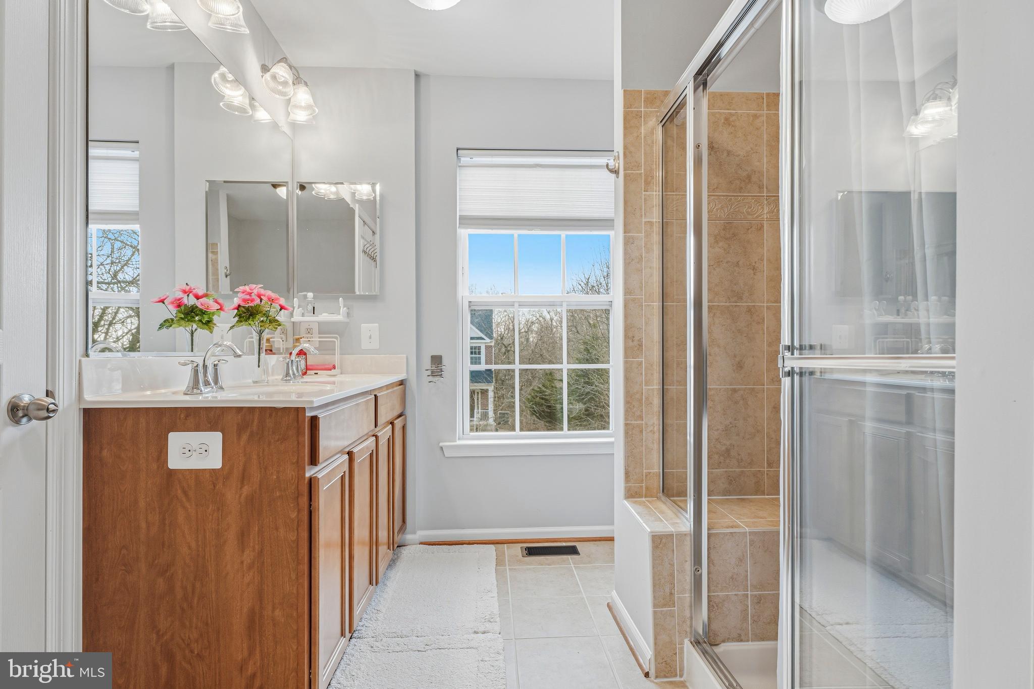 8876 Paddock Lane Baltimore, MD 21234 - Photo 18 of 37 a bathroom with a sink vanity and a mirror