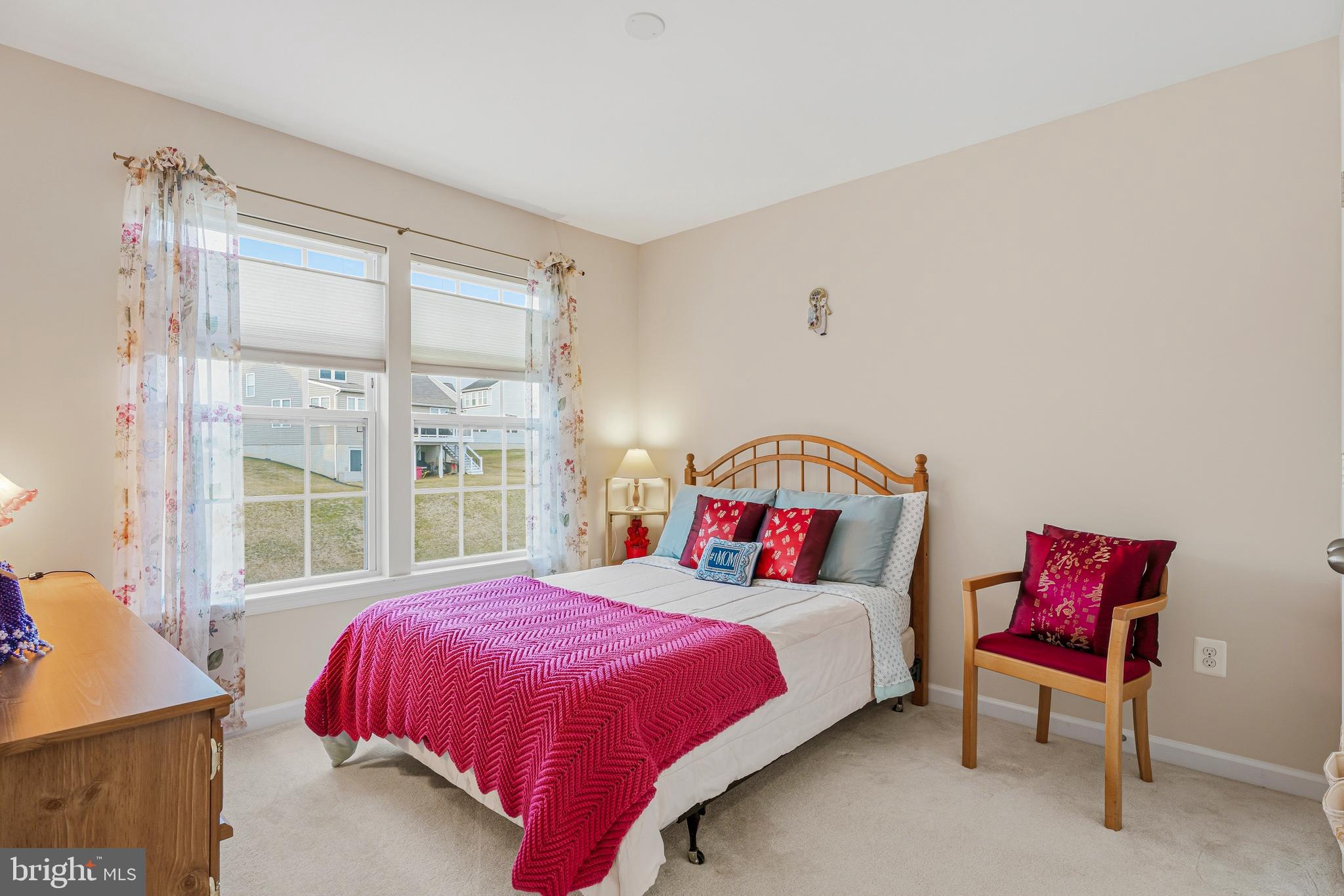 8876 Paddock Lane Baltimore, MD 21234 - Photo 20 of 37 a bedroom with a bed and a large window