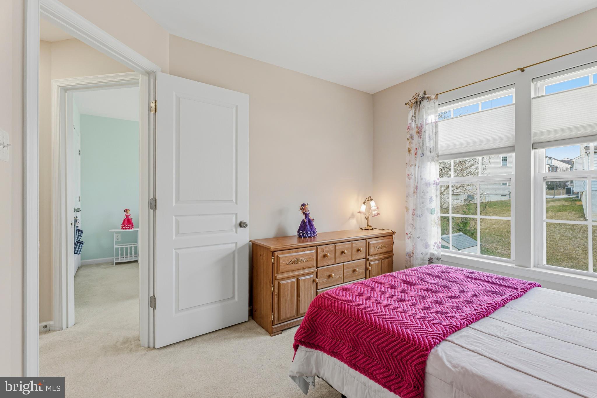 8876 Paddock Lane Baltimore, MD 21234 - Photo 21 of 37 a bedroom with a bed and a window