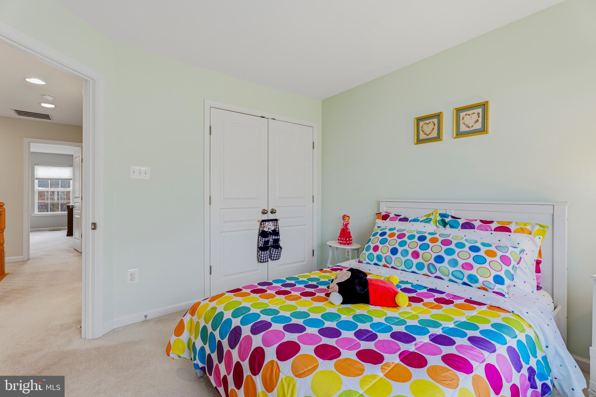 8876 Paddock Lane Baltimore, MD 21234 - Photo 23 of 37 a bedroom with a bed and a dresser