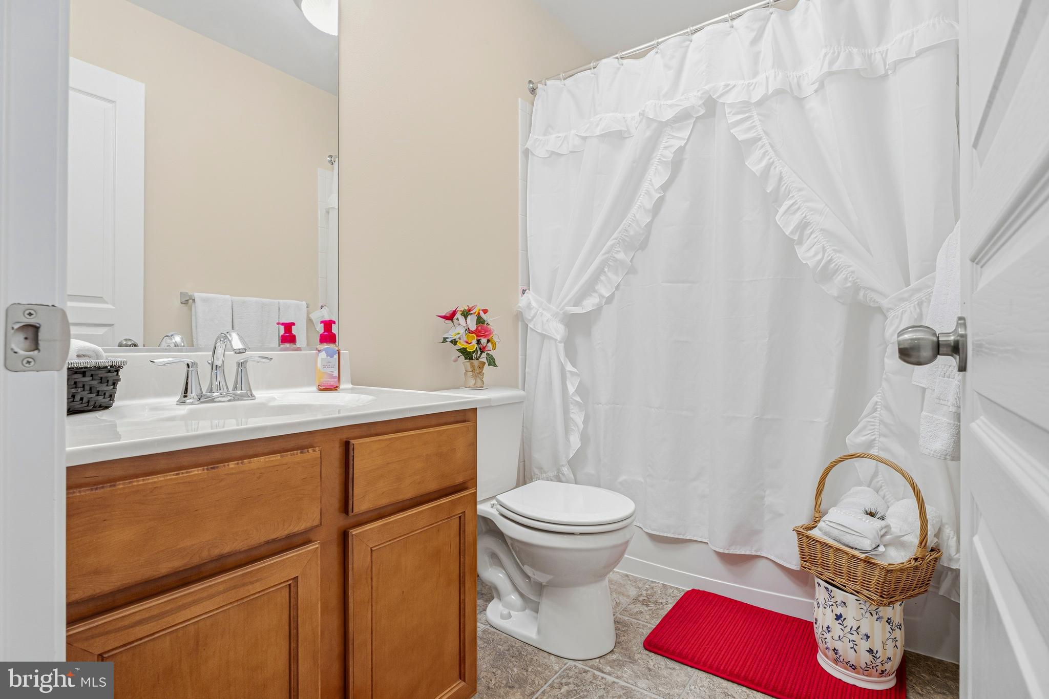 8876 Paddock Lane Baltimore, MD 21234 - Photo 24 of 37 a bathroom with a sink toilet and shower