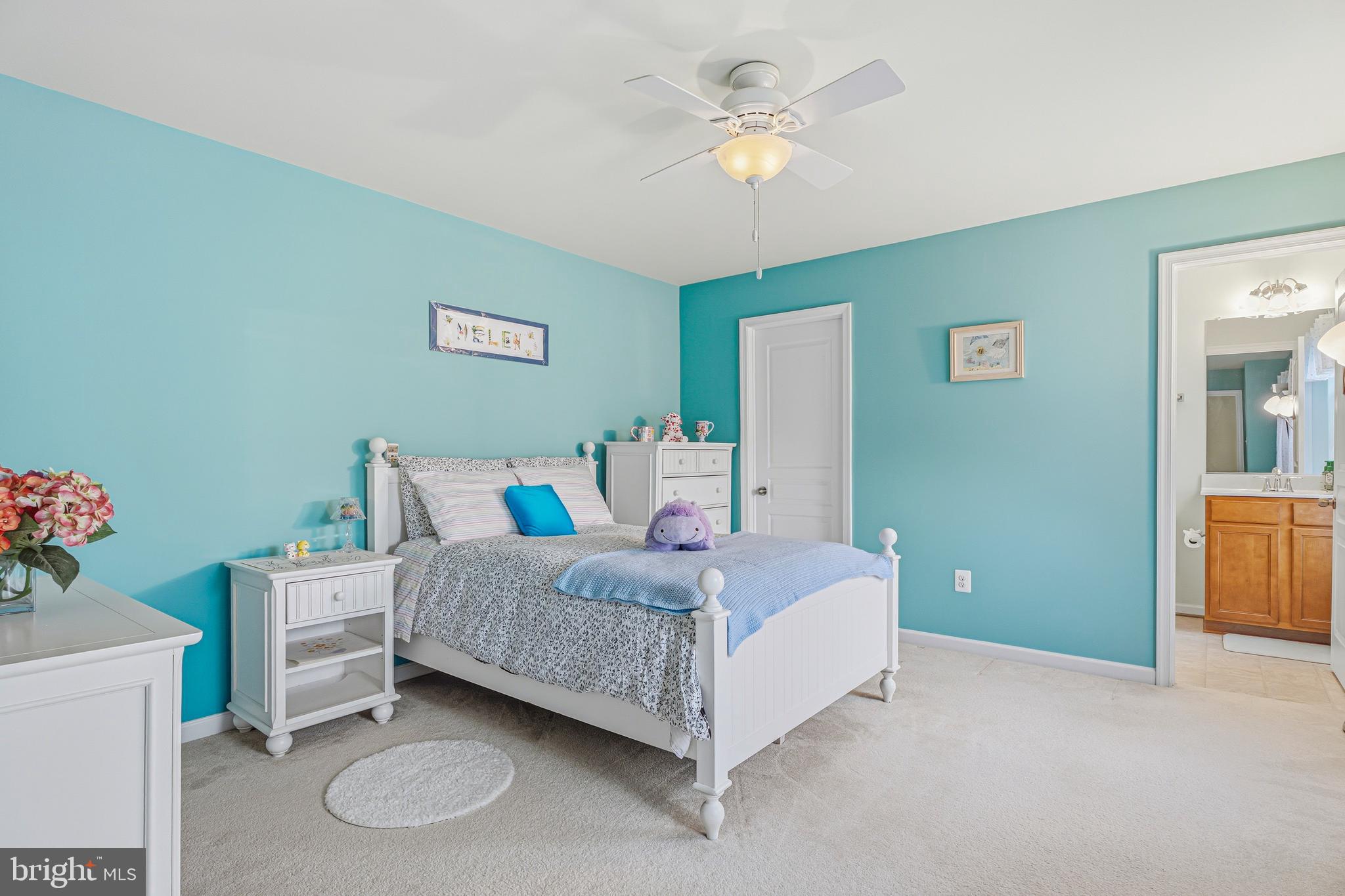 8876 Paddock Lane Baltimore, MD 21234 - Photo 25 of 37 a bedroom with a bed and a chandelier