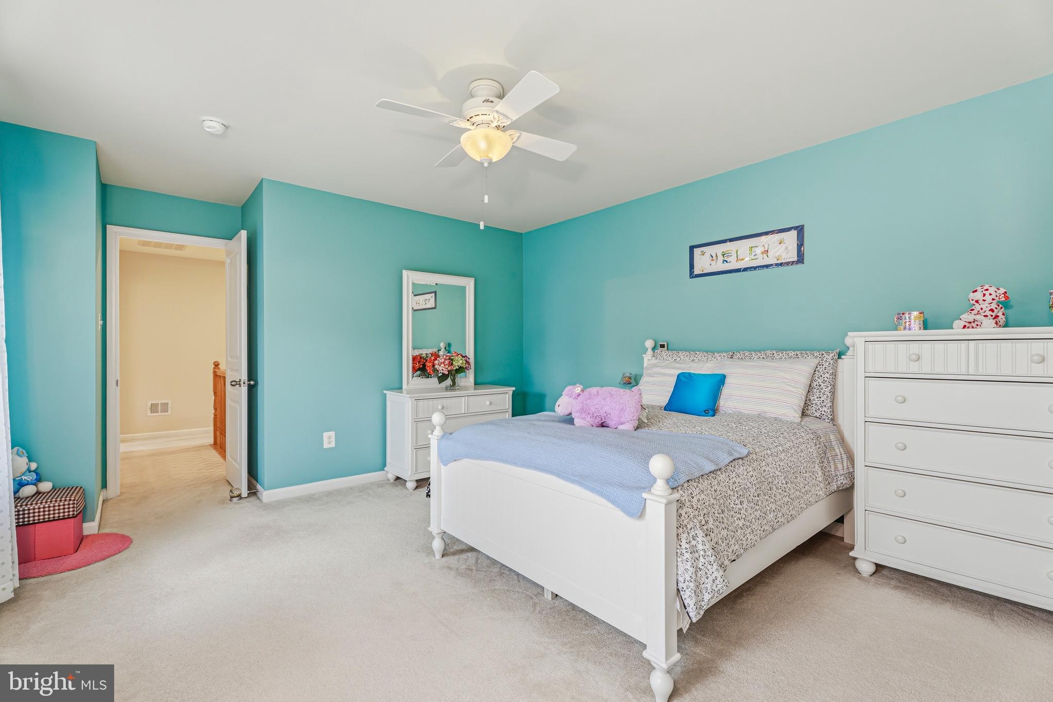 8876 Paddock Lane Baltimore, MD 21234 - Photo 27 of 37 a bedroom with a bed and a chandelier